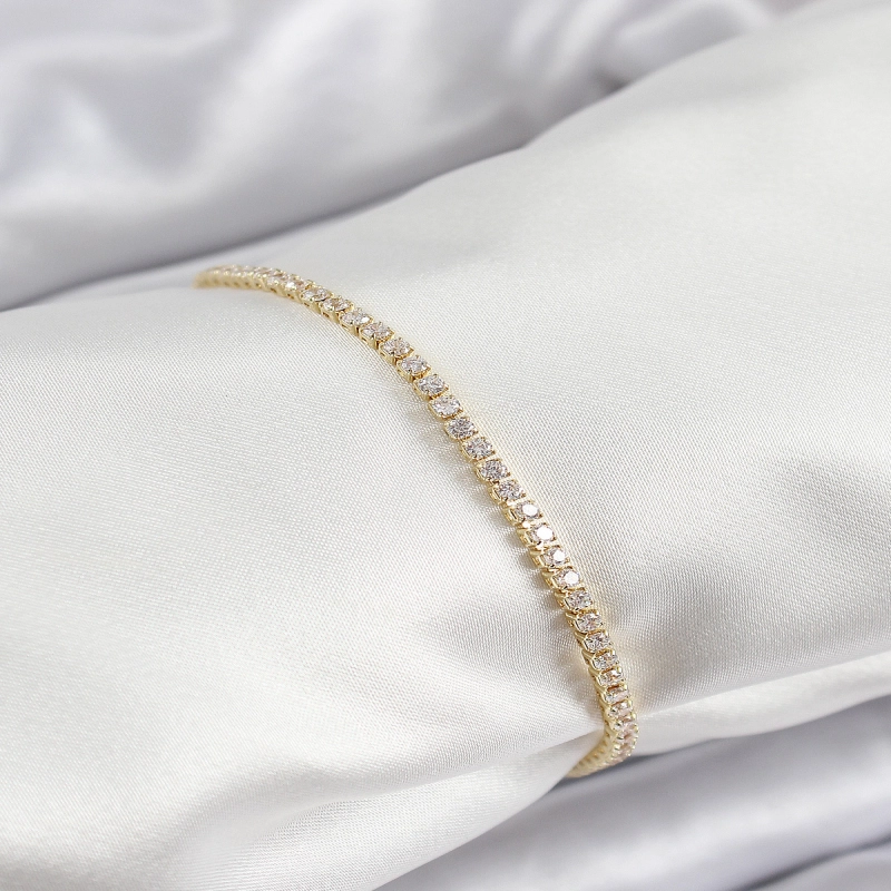 Pirinç Zirkon Taşlı İnce Su Yolu Model Gold Renk Kadın Bileklik